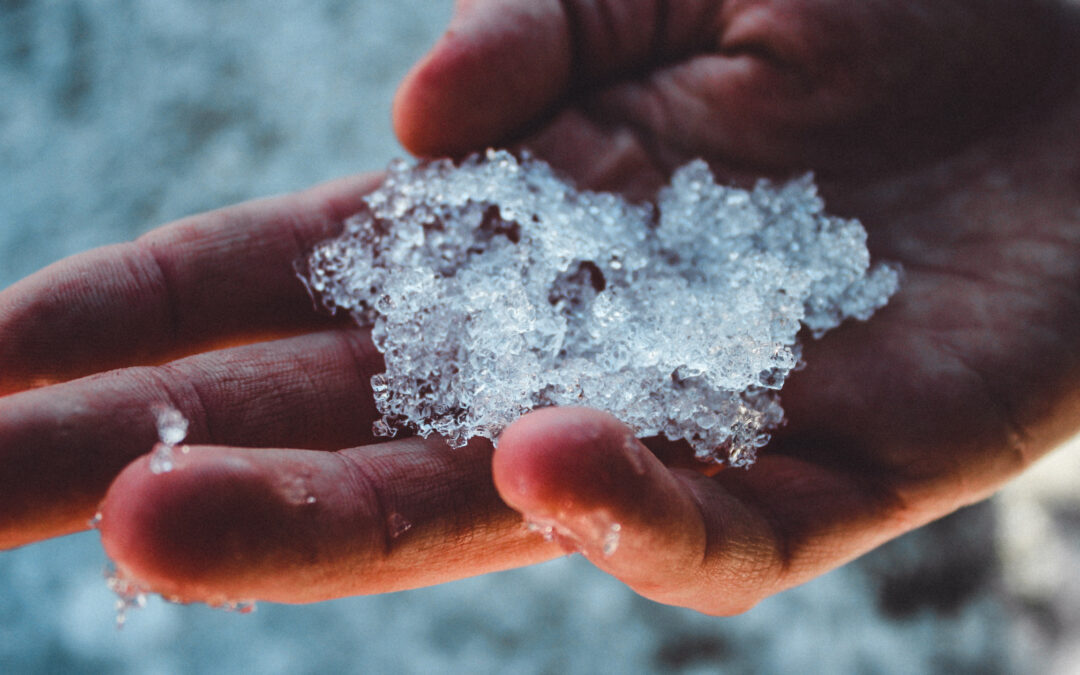 Woman holding ice in her hand