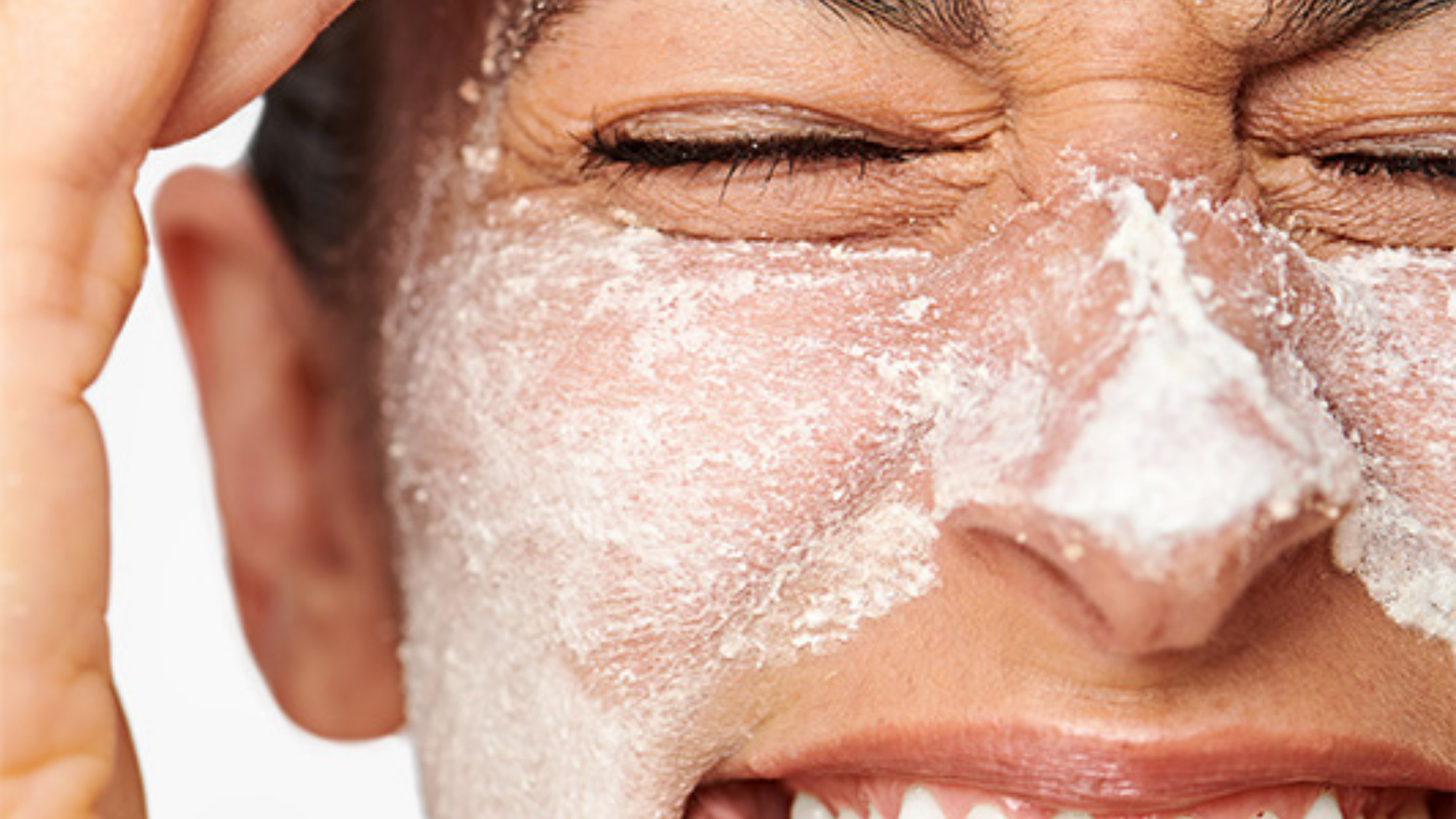 Woman using exfoliator