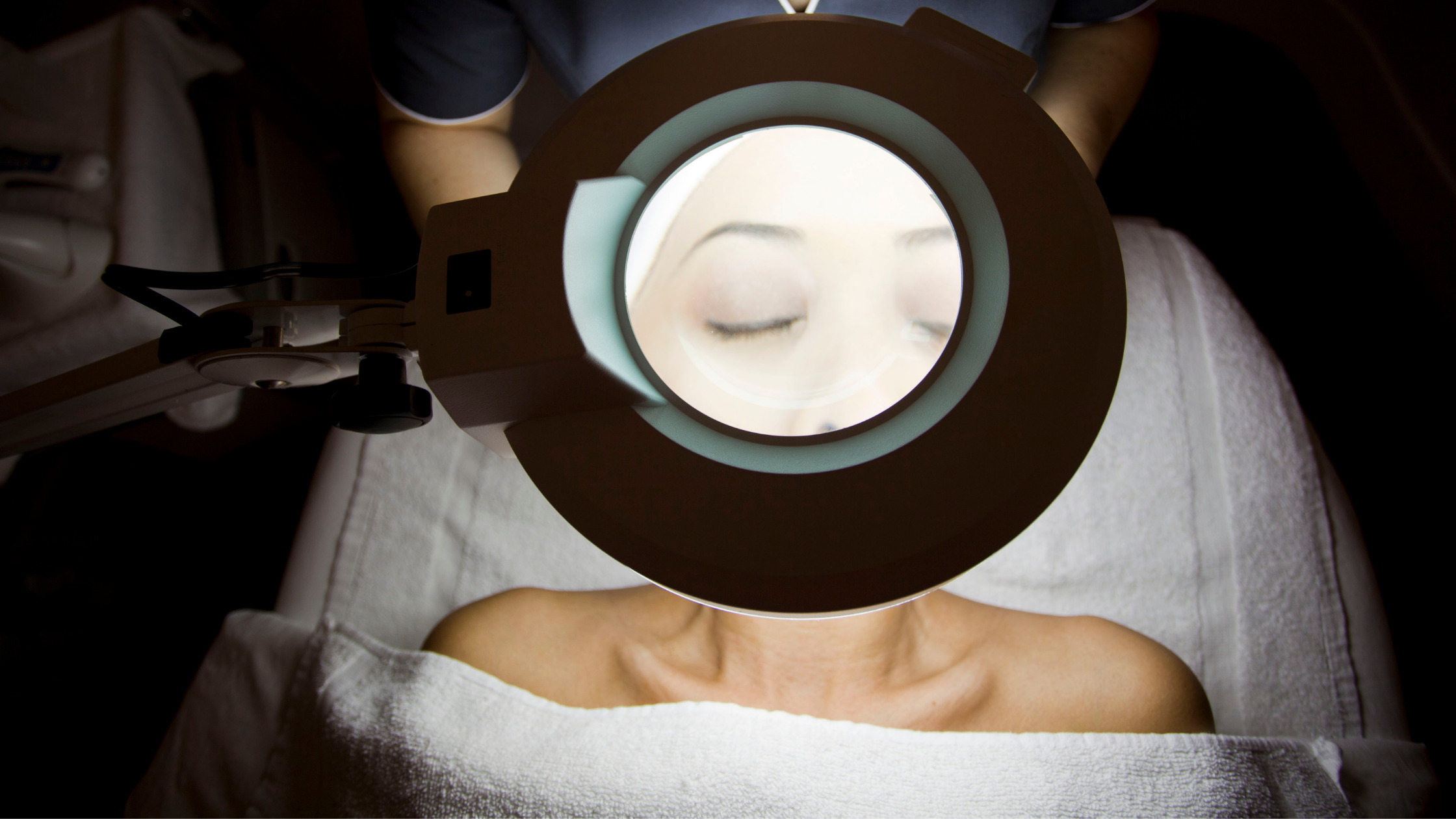 skin analysis under magnifying lamp